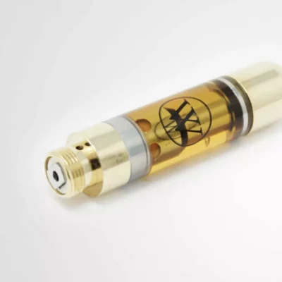 Gold vape cartridge with biohazard symbol and visible amber liquid.