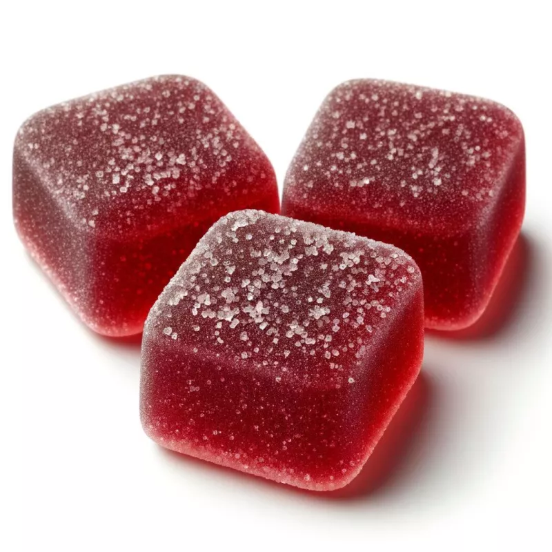 Three glossy red Liift Edibles THC gummies with sugar coating on white background.