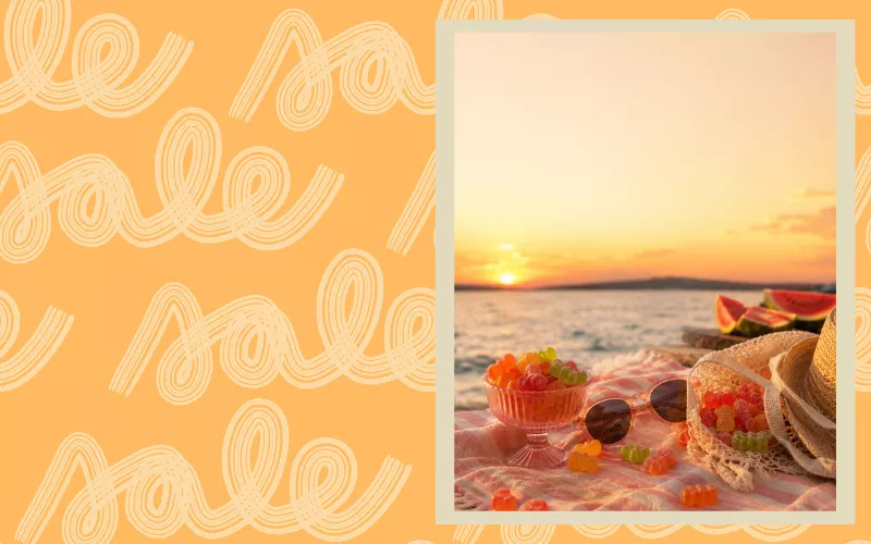 Beach sunset with gummy candies, sunglasses, and watermelon on a blanket.