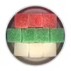 Colorful sugar cube layers in round metal container: red, green, white. Visually appealing arrangement.