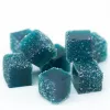 Blue gummy candy cubes with sugar coating stacked neatly.