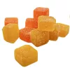 Vibrant orange and yellow sugar-coated gummy cubes stacked, showcasing citrus flavors and chewy texture.