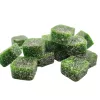 Green cubical candies with sugar coating, vibrant color, and shiny texture on white background.