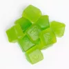Green THC gummy cubes arranged on a white background.