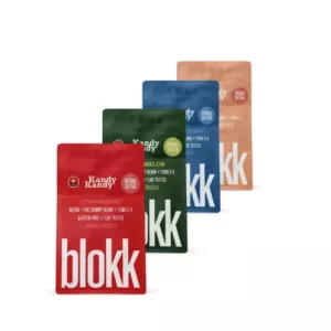 Four colorful candy packaging pouches in various flavors.