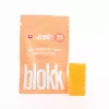 Peach-flavored Kandy Kandy THC Sativa gummies in resealable bag with single gummy block displayed.