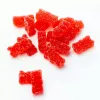Red gummy bears coated in sugar on a white background.