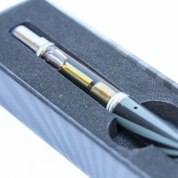 Unicorn Hunter THC vape pen with protective foam case and clear e-liquid tank.