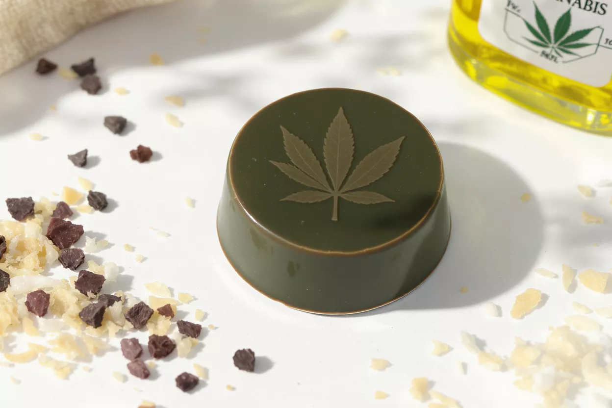 Green soap bar with cannabis leaf design