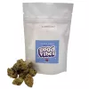White bag labeled blueberry donut with green cannabis buds beside it.