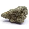 Close-up of dense cannabis bud with green hues, orange pistils, and frosty trichomes.