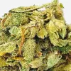 Close-up of frosty Stardawg cannabis bud with trichomes and pistils.