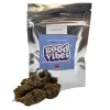Sour kush cannabis package with brown buds in front.